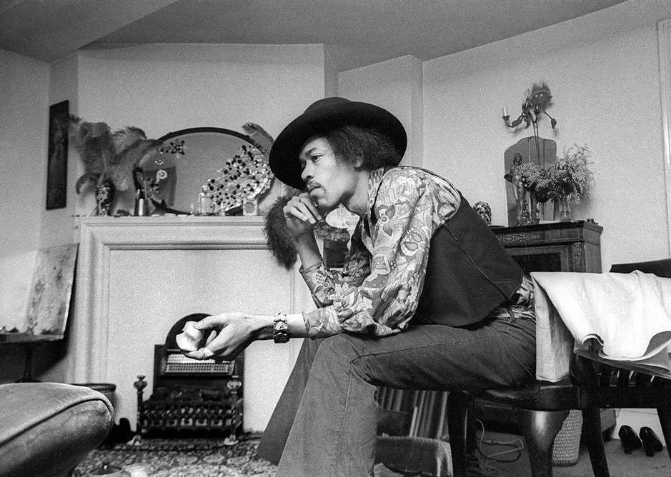 Jimi Hendrix at 23 Brook Street, 1969. The original oval mirror is part of the recreated bedroom.