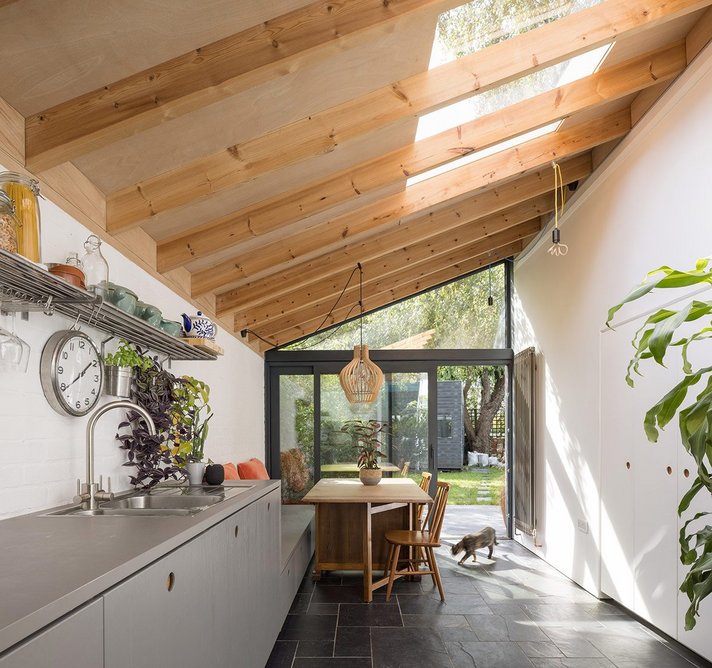 Minimum framework, maximum daylight, sky-only views: the Pitchglaze window underneath the rafters of the kitchen/diner roof.