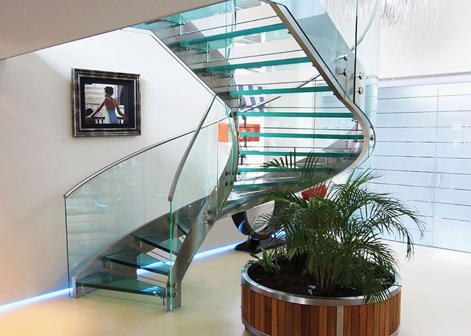 Glass and satin polished stainless steel helical staircase.