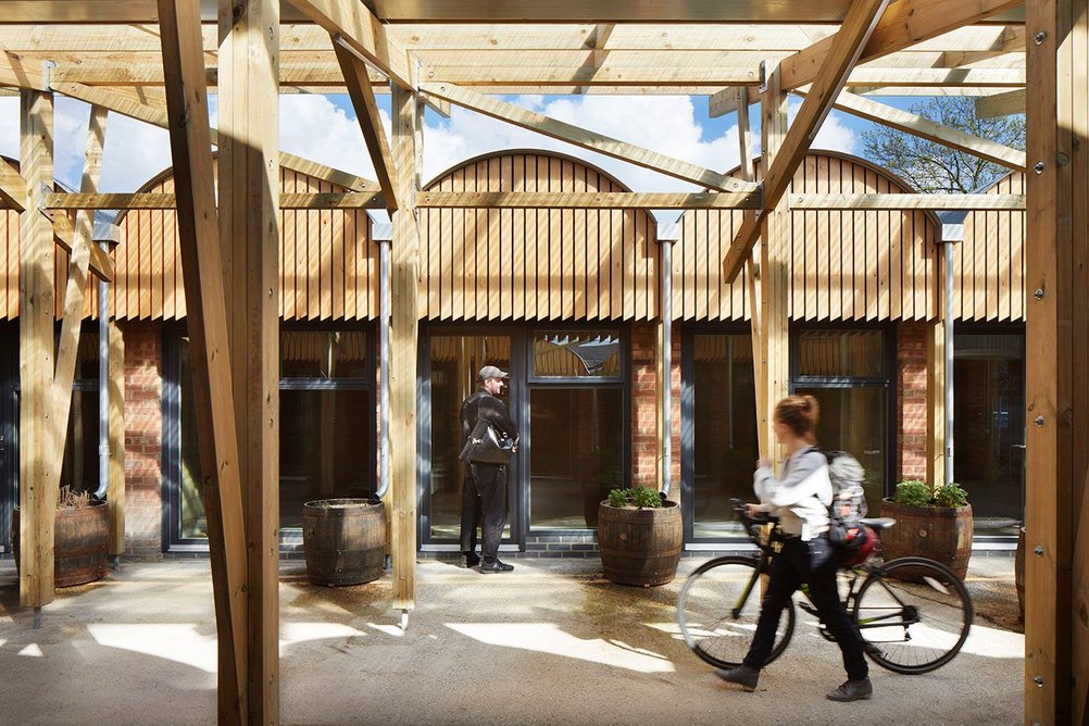 Each barrel-vaulted workspace unit has a direct relationship with the covered street, encouraging interactions.