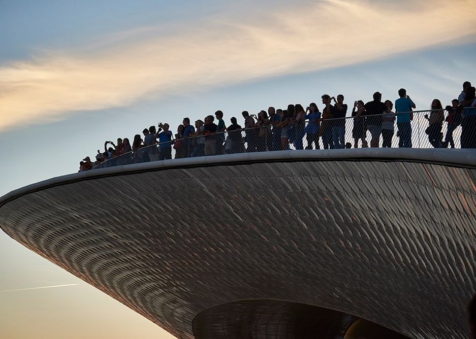 Sunset seeking crowds gather at the prow of MAAT’s roofscape.