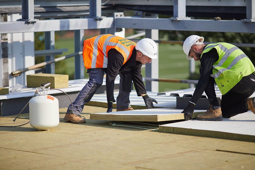 Rockwool Hardrock Multi-Fix (DD) flat roof insulation being installed at Cobham Free School, Surrey.