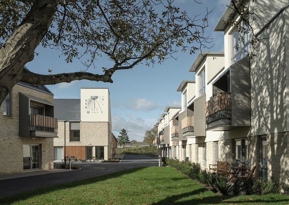 A giant sun dial marks the communal heart of Steepleton with its restaurant and common room in the building alongside.