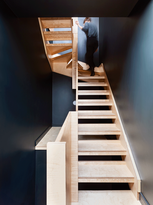 The open tread ply staircase to the upper flat makes the most of the ascent.