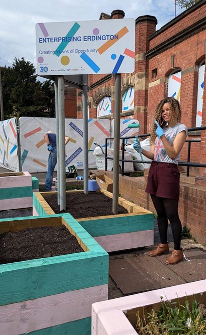 Volunteer, Selina, painting pocket park outside Erdington Baths, Erdington.