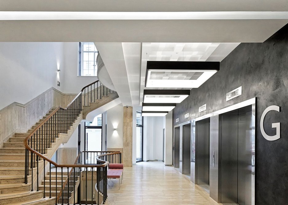 The south east wing’s hidden lift lobby is approached using a white plaster wall that draws you in.