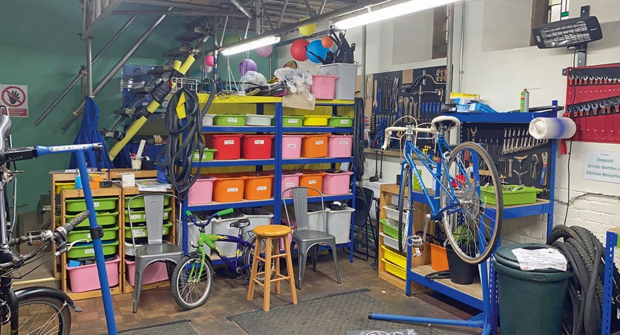 Tucked away beside the chancel is a two-floor bike workshop providing skills training.