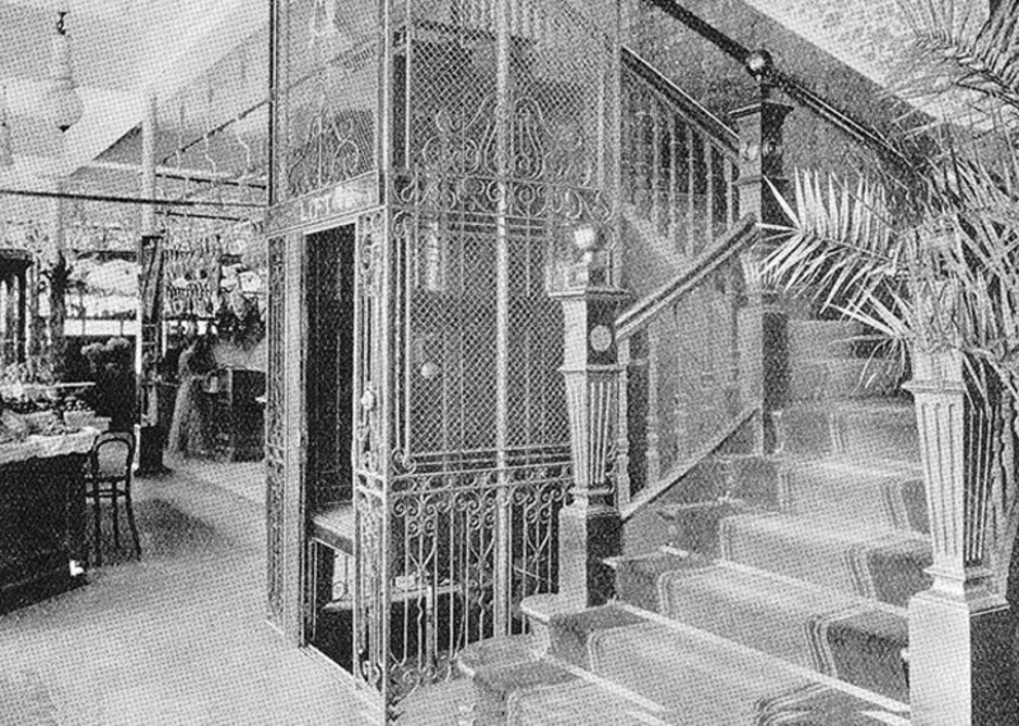 An early highly ornamented Stannah lift shown in black and white.