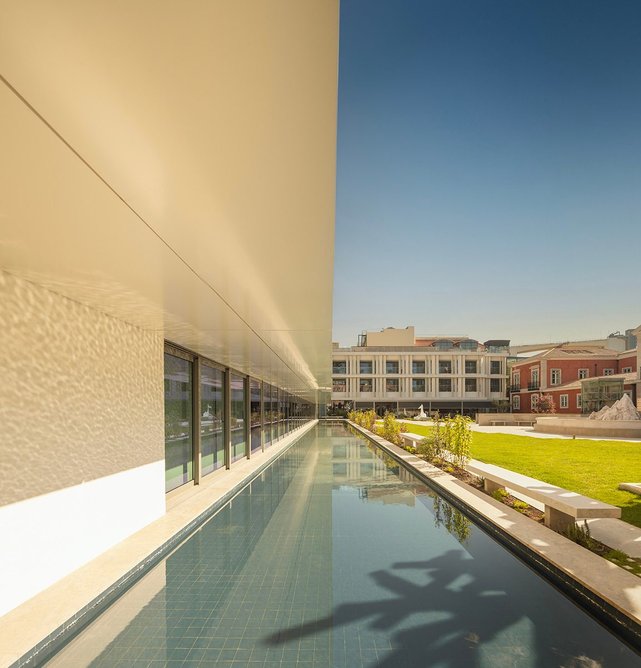 A shallow pool runs the length of the exhibition galleries.