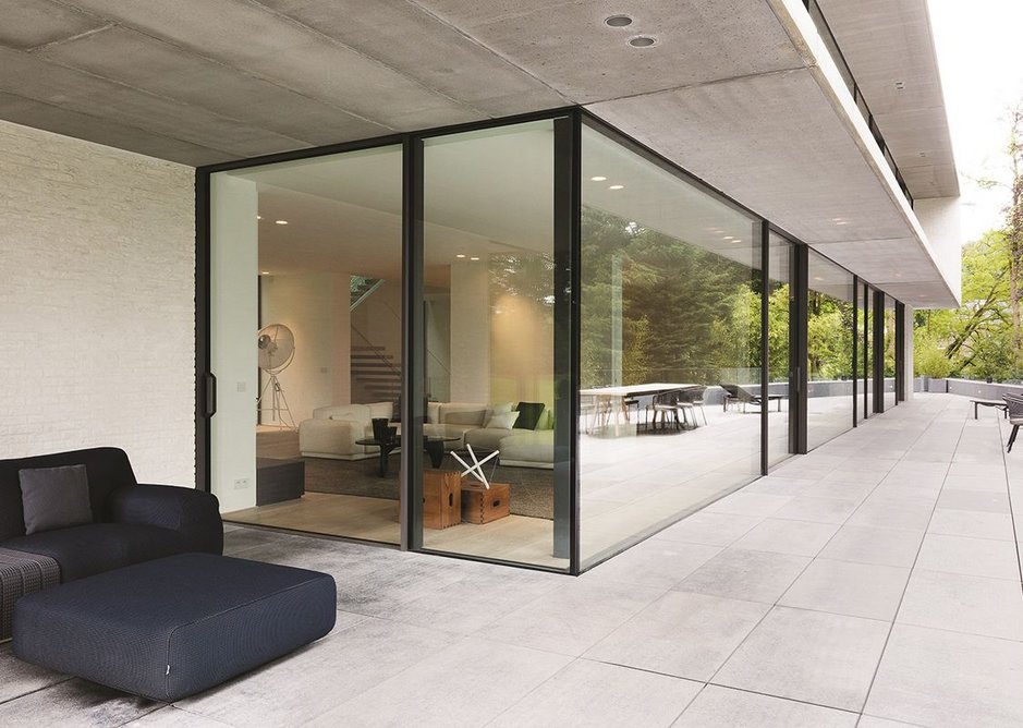 Floor to ceiling glazing from Reynaers at a house designed by Atelier d'Architecture Bruno Erpicum in Belgium.