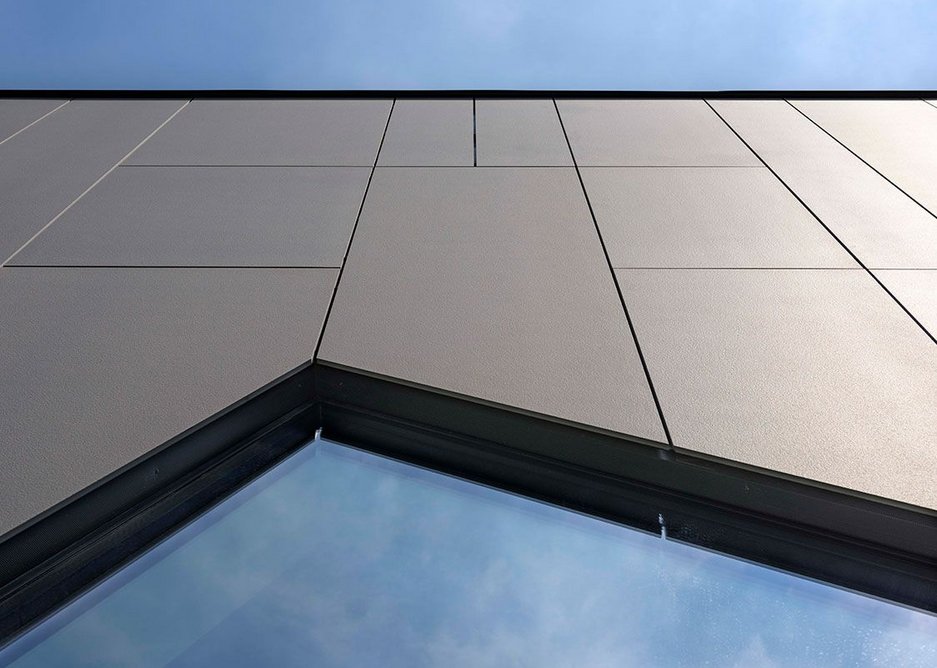 Lapitec ventilated facade using large format, 12mm panels in Grigio Piombo Vesuvio (textured finish). Every slab is resistant to acids, alkalis, deep abrasion, fire and frost and is unaffected by UV rays.