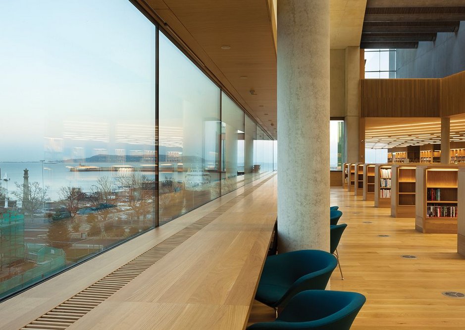 Unobtrusive framing maximises sea views from the library.