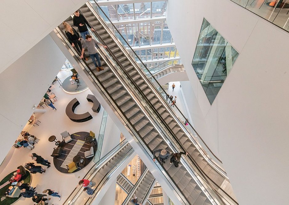 Looking up and down the atrium to the escalators and bridges that encourage a slow route of exploration through the many different attractions of the building.