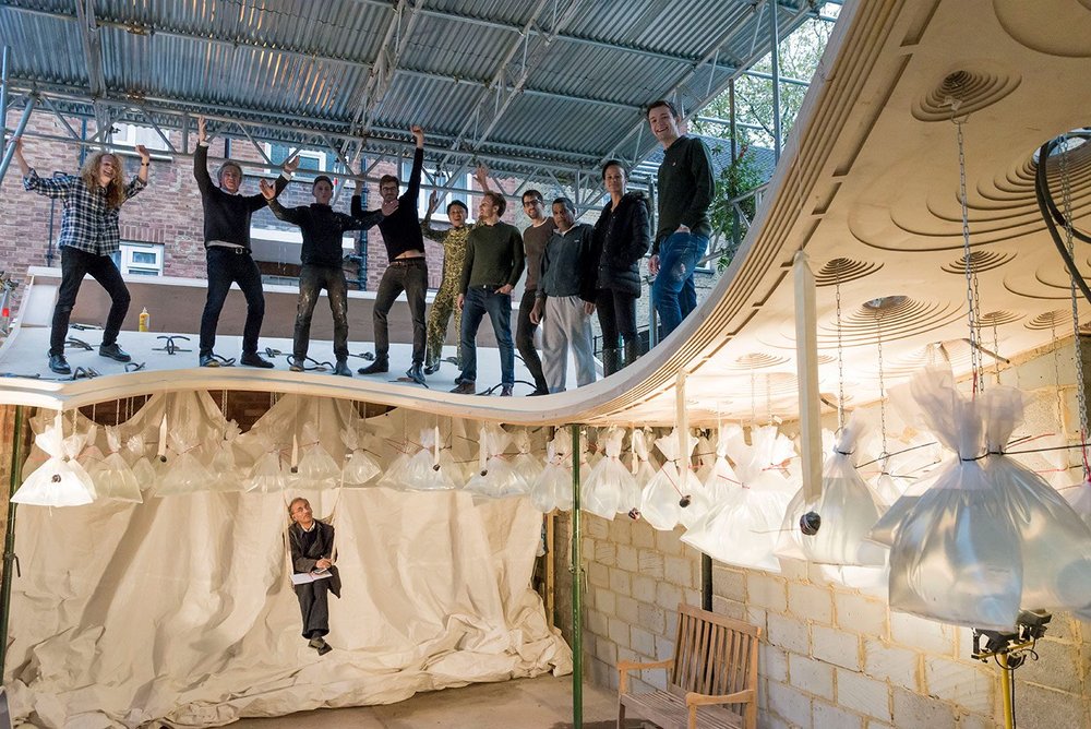 On site during the construction of Sun Rain Room, with engineer Mervyn Rodrigues seated below.