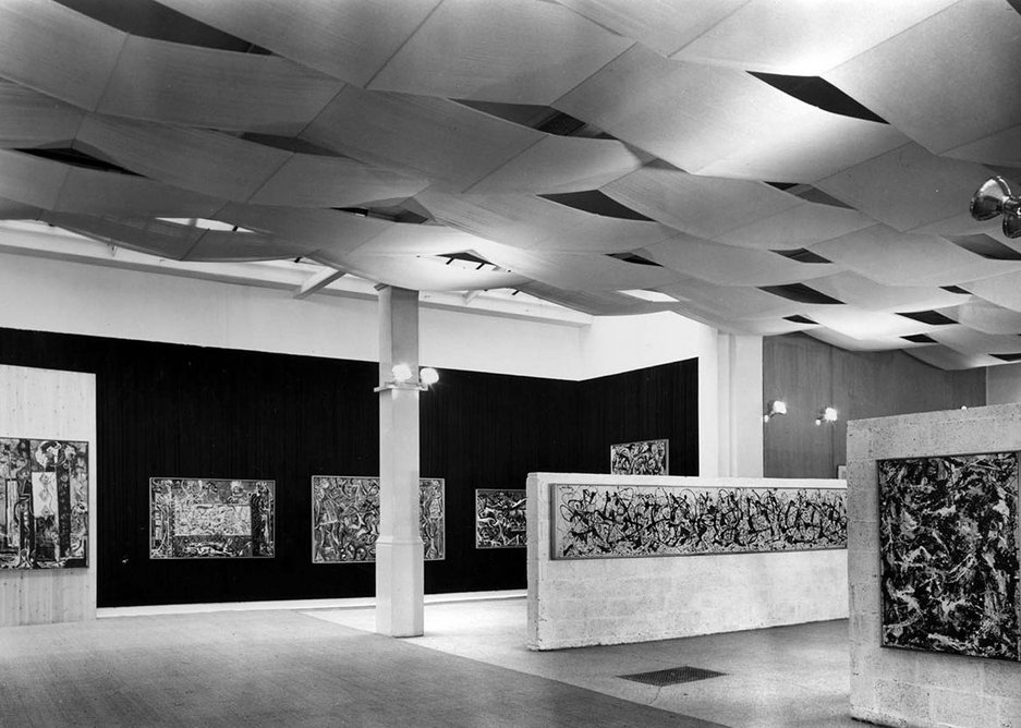Installation view of Jackson Pollock exhibition 1958, designed by Trevor Dannatt at the Whitechapel Gallery. © Whitechapel Gallery. Paintings were hung on a variety of fabric, wood and breezeblock backgrounds.