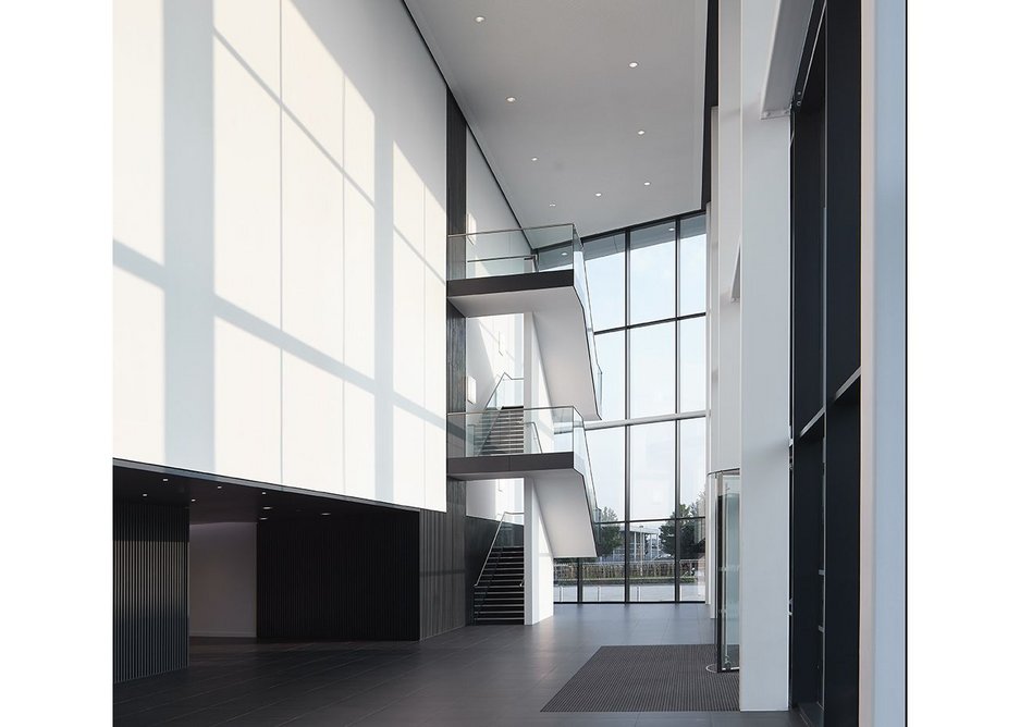 The triple height new entrance is achieved  with the Schueco FW 60+ capped system.
