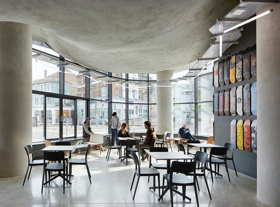 The café/bar has a polished concrete floor that contrasts with the rougher bowl underbelly ceiling. It’s a welcoming space with views on to the centre of Folkestone that make visitors feel part of the action.