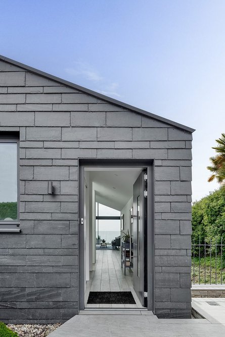 Cupa Pizarras Cupaclad 101 Random natural slate cladding on the front elevation of one of the homes.