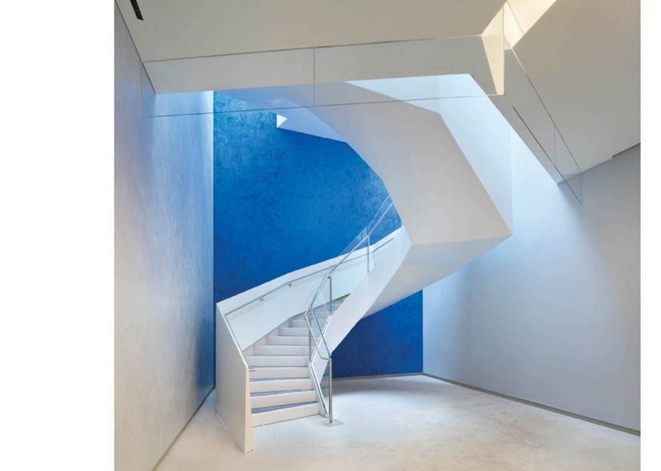 A splash of  richly coloured plaster marks Maki’s staircase linking the auditorium foyer levels.