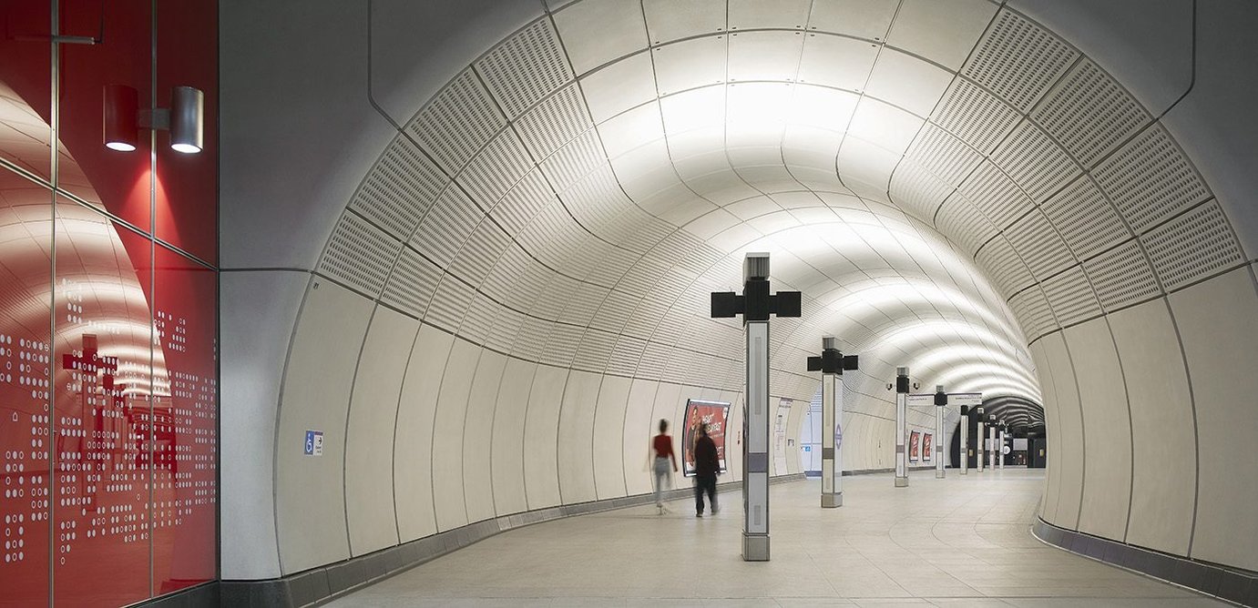 Concourse at Tottenham Court Road Station showing service totems with integrated uplighting.