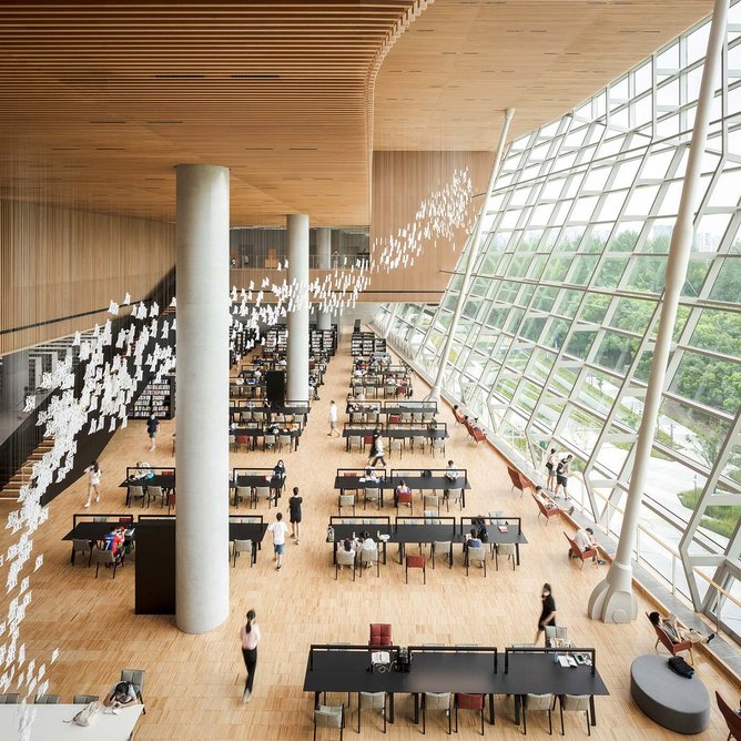The triple-height reading hall. Large, glazed areas - the biggest measuring 42x22.5m - bisect the monolithic outer form.