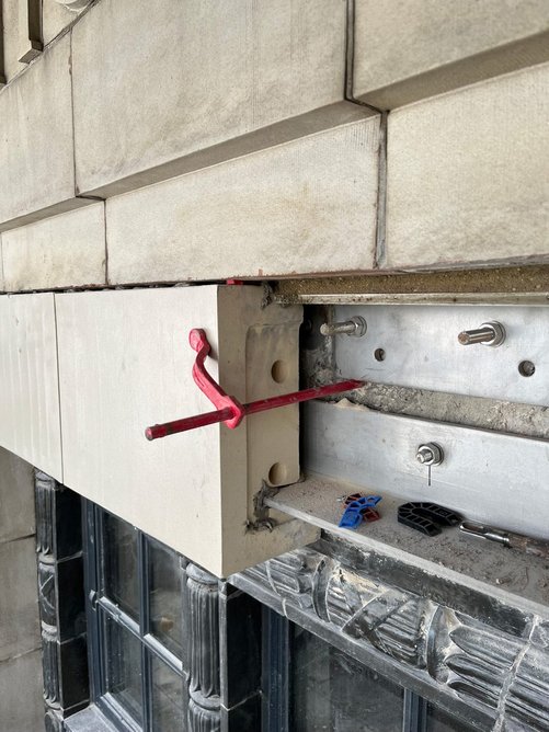 Due to rusting and erosion behind the tiling, new stainless-steel brackets had to be installed.