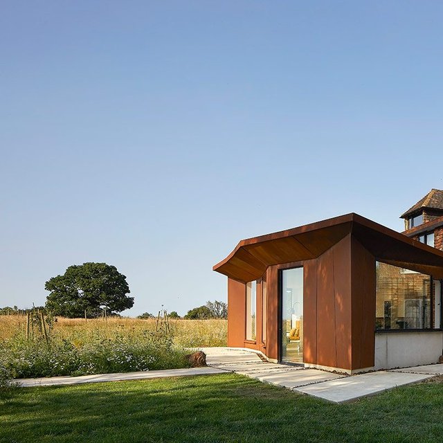 Upper Maxted uses rust-coloured steel to blend with its rural context