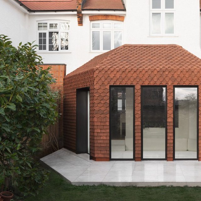 This unusually shaped rear extension to a north London semi accommodates a sunken living room