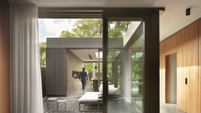 One of three courtyards running along the home’s deep plan, which help blur the distinction between inside and outside.