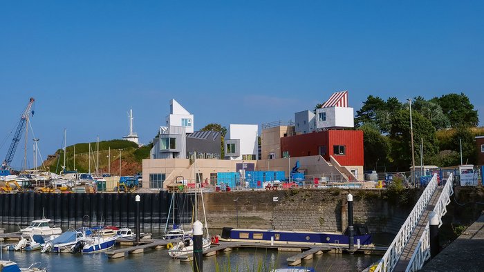 The plinth has a kinship with the harbour walls; Piers Taylor sees the blocks and accommodation pods as growing out of it like a new bit of town at the end of the Esplanade.