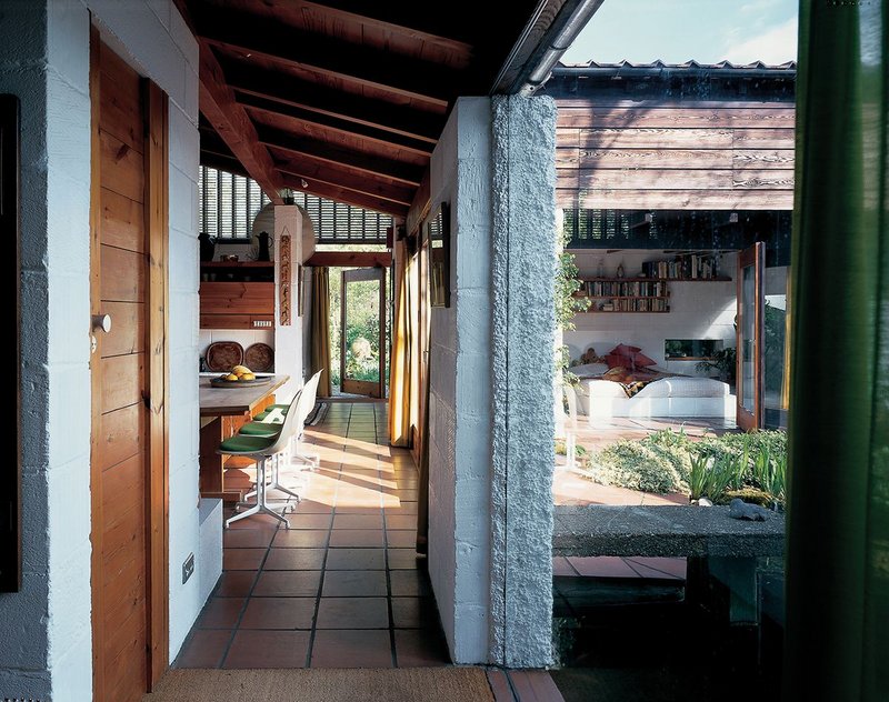 Through that double-glazed unit to the pond landscape on one side, and the path through living spaces to the garden beyond.