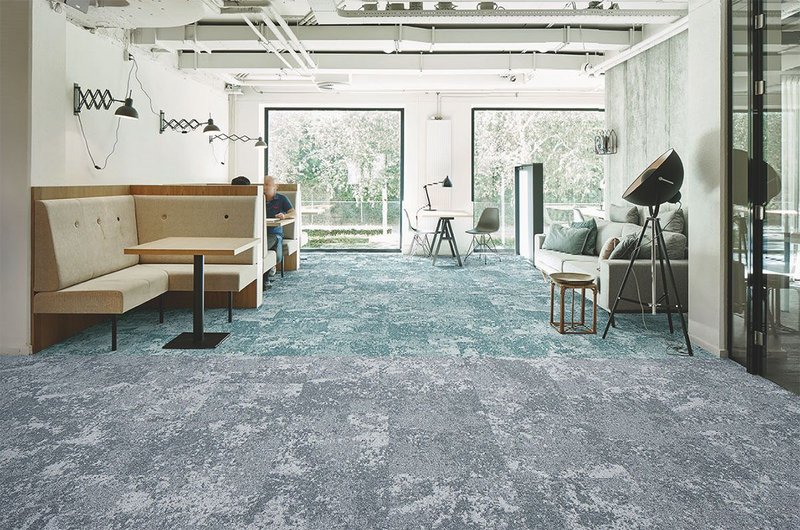 Forbo's Tessera Cloudscape carpet tiles in two shades - 3402 Ocean Winds (back) and 3401 Light Airs (front).