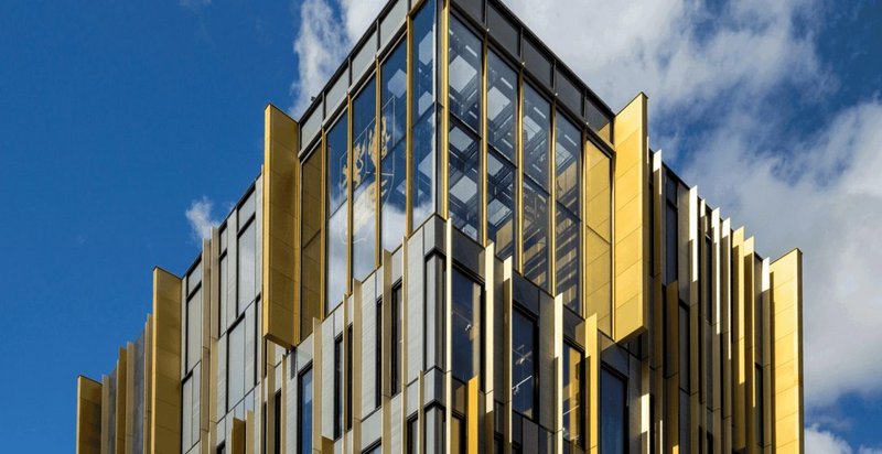 Bailey anodised rainscreen cladding at University of Birmingham Library: external fins and a gold and grey colour palette create a striking hub at the heart of the campus.