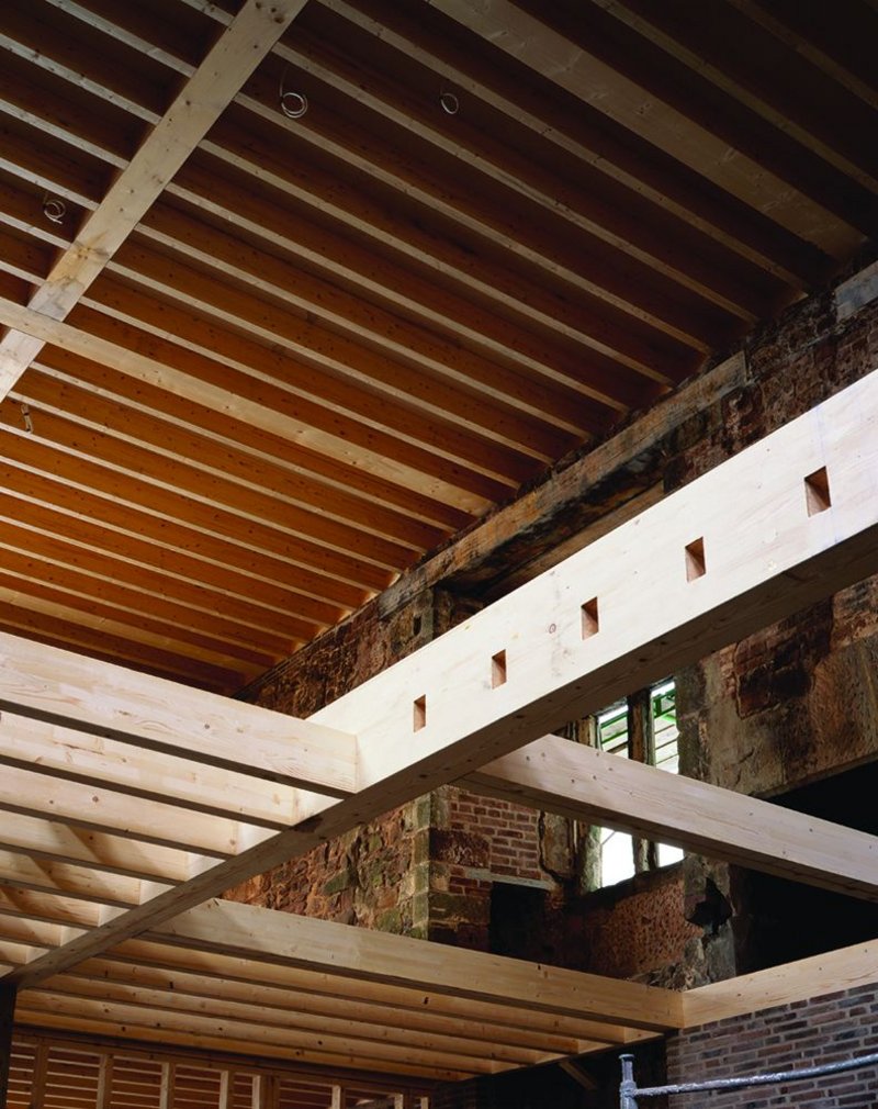 Laminated timber structural joists are crisply detailed at their interfaces and create the upper living level.