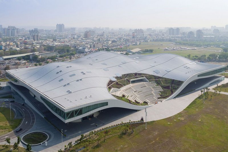 Southwest elevation of the complex showing the park-facing amphitheatre. The 35,000m2 standing seam roof covers the Banyan Plaza, four music halls, lobbies and all their support and admin spaces.