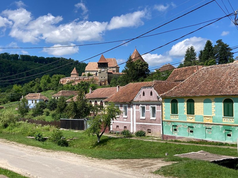 Saxon village street scene with fortified church.