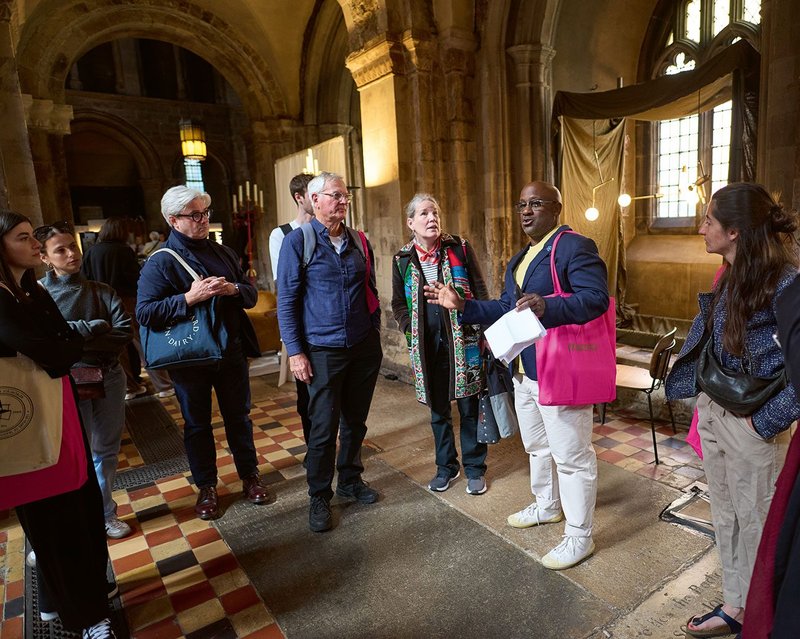 Kunle Barker leading a walking tour taking in showrooms, history and makers.