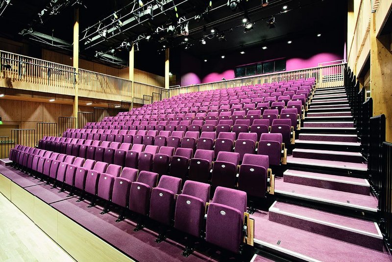 The main auditorium is a beautifully warm space lined with a gallery and panelling in oak.