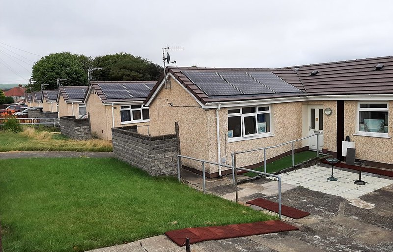 Six recently- retrofitted homes in Swansea, Wales. Formerly off the mains gas grid, very energy inefficient and expensive to heat, with damp, mould and low SAP ratings, a whole-house zero carbon retrofit by Swansea City Council took their EPC from G to A.