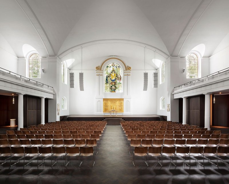 Saint, previously known as St Johns at Hackney, facing east towards the altar, flanked by speakers.