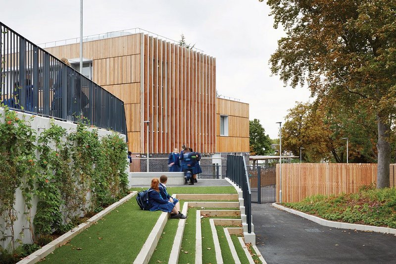 Sutton Harris Academy looking west. The UK’s largest Passivhaus secondary school nestles comfortably into its low-density suburban landscape.