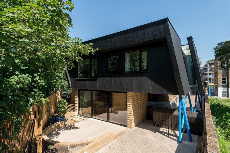 Pitched Black house in Lewisham. The glazing is to the side and rear elevations with no windows on the front.