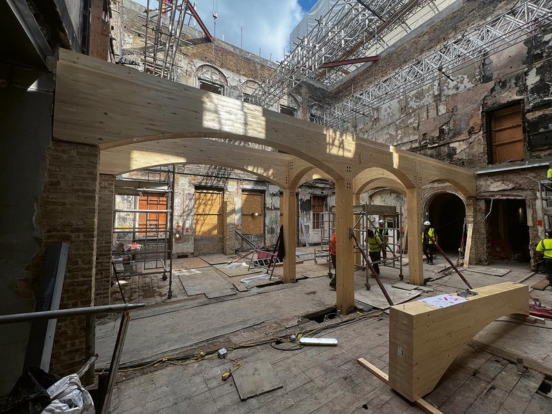 The ground floor cafe glulam structure before the addition of the CLT floor slab. The structural insertion took just three weeks.