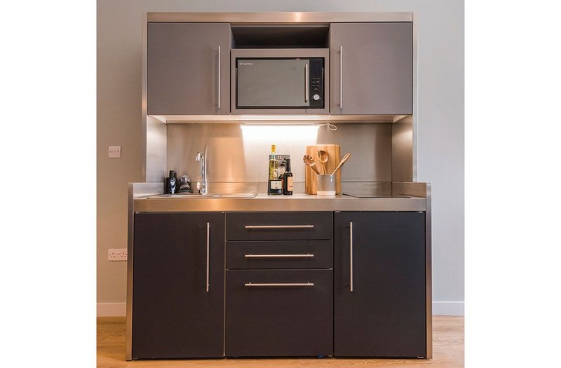 Elfin's Premium Bespoke range brings wall units, appliances, storage, sink, worktop and splashback into one space-saving unit.