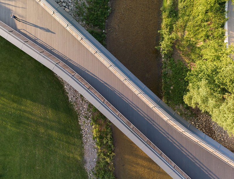 Drone’s-eye view of the sleek curved structure.