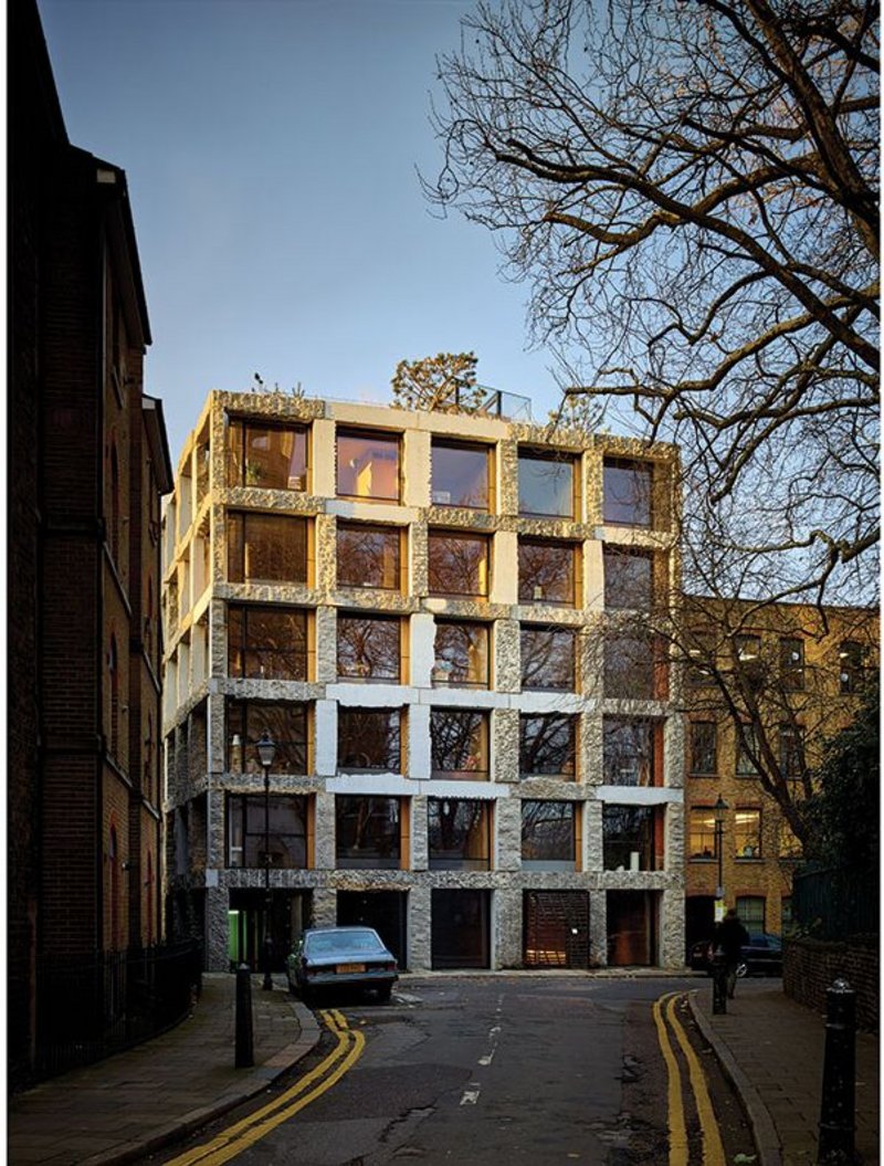 The main east elevation of 15 Clerkenwell Close shows the curious limestone exoskeleton with its various surface treatments.