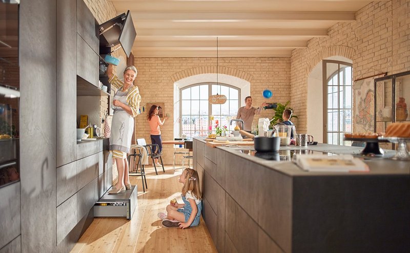 Blum's SPACE STEP improves access to tall units above while providing storage below.