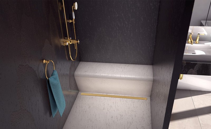Shining bright: shower drainage channel with Wedi Fundo Metallic Gold cover.