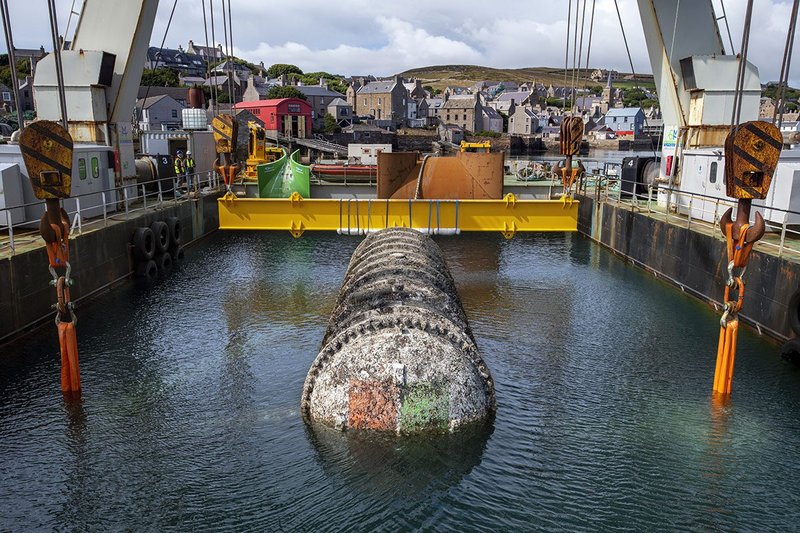 A thin coat of algae and barnacles formed on the steel tube during its two-year mission.