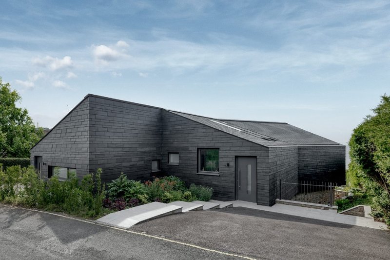 Double frontage: from the roadside, the two homes by AR Design Studio appear as one.